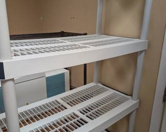 One of two plastic shelving units