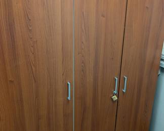 Three-Door wooden storage cabinet one of two