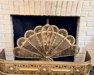 Brass peacock fireplace screen and fender