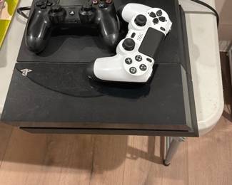 PlayStation and 2 controllers