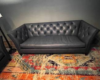 Leather tufted sofa by Ethan Allen