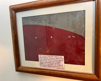 Japanese Zero Aircraft Skin: An incredibly rare, museum-grade piece of red-and-gray painted metal fuselage skin from a Japanese Zero fighter aircraft built by Nakajima at Koizuma, Japan in 1942. Assigned to the 253rd Imperial Japanese Naval Air Force and heavily damaged during an Allied aerial attack near New Ireland in the South Pacific, this piece features documented verification noting its sister remains await restoration at the U.S. Air Force Museum at W.P.A.F.B. right here in Dayton, Ohio!