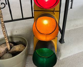 An awesome, authentic Crouse-Hinds full-sized three-light traffic signal fully wired and illuminated for indoor residential use
