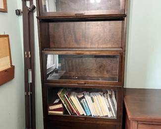 An exceptional antique solid wood five-tier sectional barrister bookcase manufactured by the legendary C. J. Lundstrom Mfg. Co.