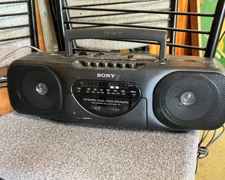 Sony Boombox: A classic black Sony AM/FM cassette player/radio with integral dual cone speakers.