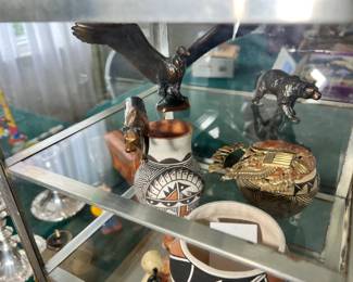 A rare collection of vintage mid-century solid bronze prehistoric animal figurines sculpted by William Otto for the La Brea Tar Pits, featuring detailed, heavy-cast models