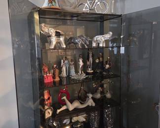 Figurines and glass China Cabinet