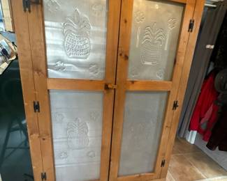 Handmade wood armoire with punched metal design