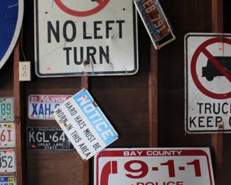 No Left Turn and 911 Signs