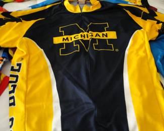Lots and lots of biking racing shirts, University of Michigan biking racing shirts