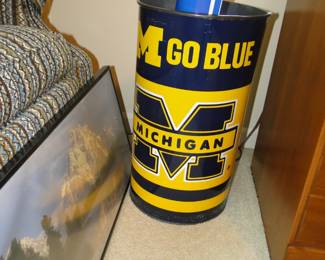 University of Michigan trash can. And no idea as to what those rolled up things are