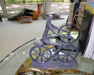 Bicycle art, and a pile of stuff in the background