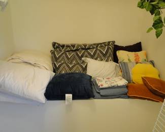 A large shelf of pillows