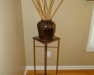 Plant stand with vase and reeds