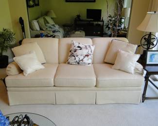 Cream colored sofa. Or is it a couch!? Let's just call it a Davenport (Google it!)
