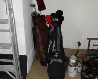 Couple of bags of golf clubs