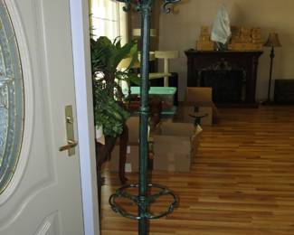 Tall, solid metal umbrella and coat stand. You can also use it to put a hat on it too