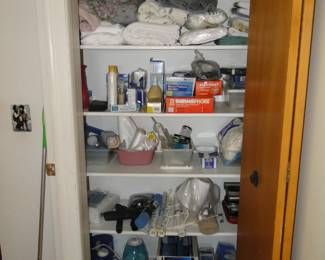Closet filled with towels, and personal care products