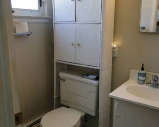 Tall wicker over the toilet storage cabinet