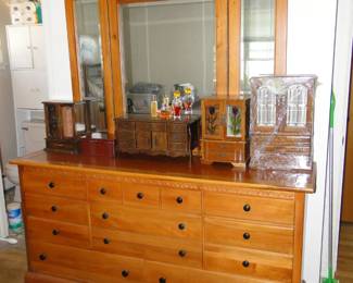 This dresser and mirror combination offers plenty of storage, and you can watch yourself putting clothing away too!