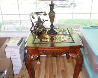 Ornate side table, fun phone, and table lamp too