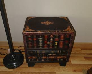 Hidden storage in this nice cabinet, with a book theme