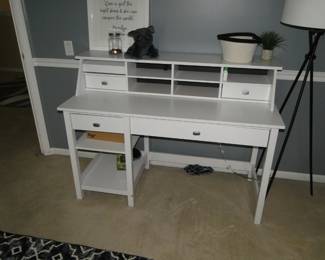 White desk with assorted decorative items
