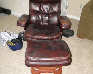 Leather swirler chair (yes swirler is a word)  along with the matching ottoman 