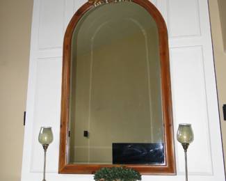 Pair of candlesticks, small faux floral vase, and large arched mirror