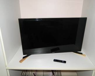 TV, flat screen.  On shims.  Something isn't straight here