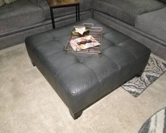 Large grey leather ottoman, with small serving tray