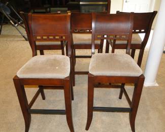 Solid wood, bar height stools.  We have a total of 5