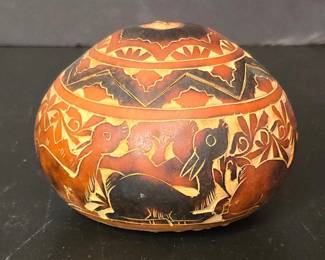 Hand Carved Peruvian Gourd Container with Figurative Motifs