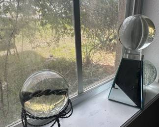 Glass Sphere on Twisted Metal Stand and Geometric Glass Sculpture
