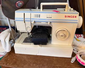 Singer electronic control machine featuring 17 built-in stitch functions.