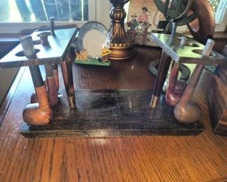 Vintage pipe stand with pipes