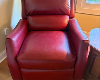 Two matching red recliners