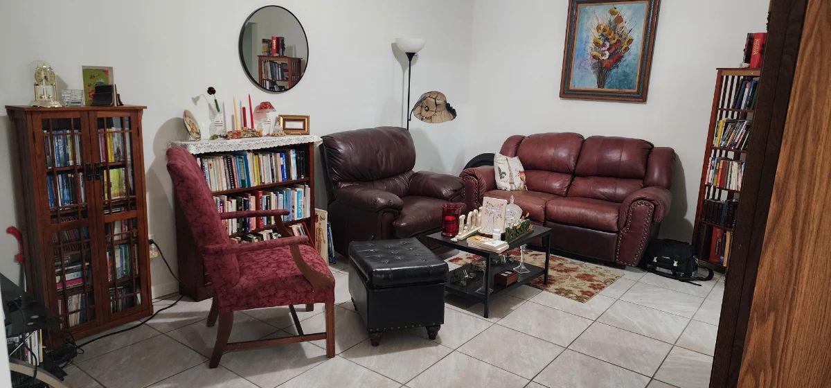 Inside-home estate sale featuring furniture, books, décor, cookware, kitchen items, and household goods throughout the residence.