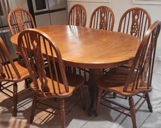 This is a heavy real wood dining set — not particle board or veneer
