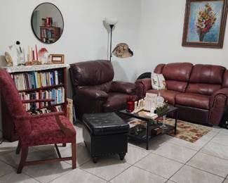 Inside-home estate sale featuring furniture, books, décor, cookware, kitchen items, and household goods throughout the residence.
