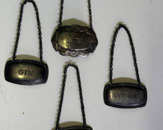 Four vintage hang tags for liqueur carafs