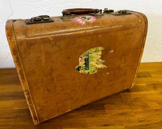Vintage leather suitcase with original stickers