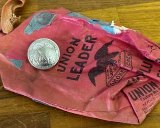 Old tobacco pouch and half dollar embellishment