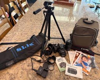 Canon Rebel T2i camera with extra lens, case, tripod and tripod case