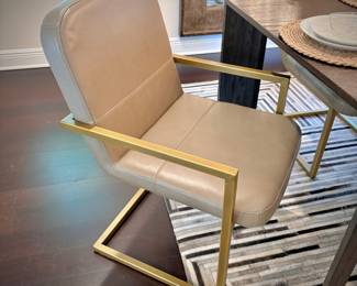 Restoration Hardware “Arles” dining table and 10 leather and brushed gold dining chairs