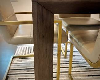 Restoration Hardware “Arles” dining table and 10 leather and brushed gold dining chairs