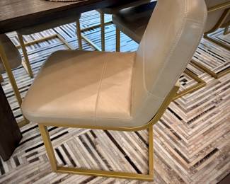 Restoration Hardware “Arles” dining table and 10 leather and brushed gold dining chairs