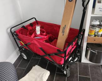 red cart, folds flat into carry bag