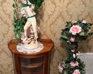 Glass front display cabinet, faux flowers