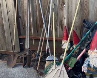 Assorted Garden Tools and Decorative Gnomes